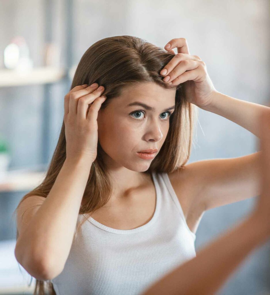 Woman checking for hair loss